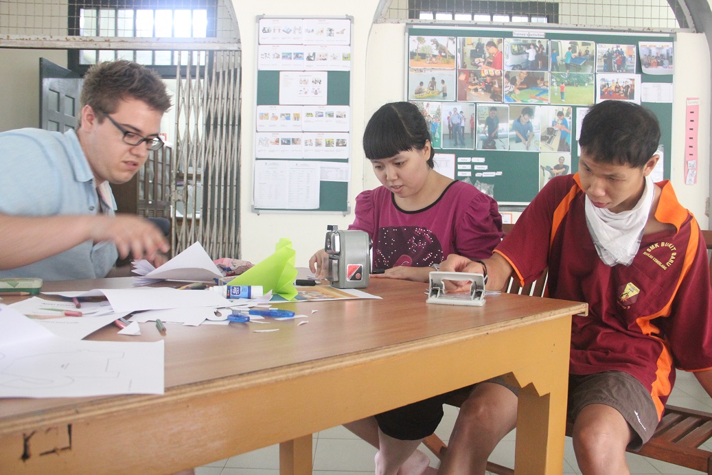 Art and craft session with a volunteer and students
